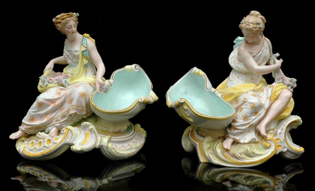 Appraisal: A PAIR OF CONTINENTAL PORCELAIN FIGURAL COMPORTS Each modelled as