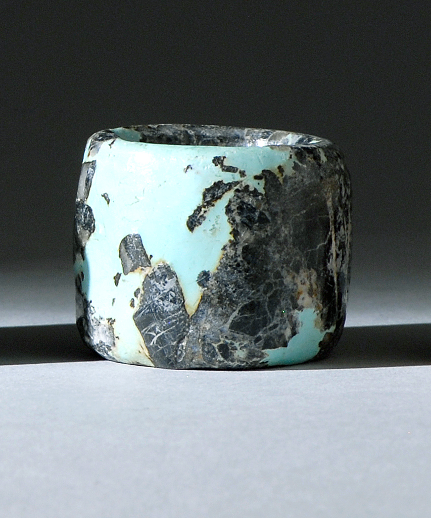 Appraisal: TURQUOISE ARCHER'S RING th CenturyIn black with blue-green inclusions From