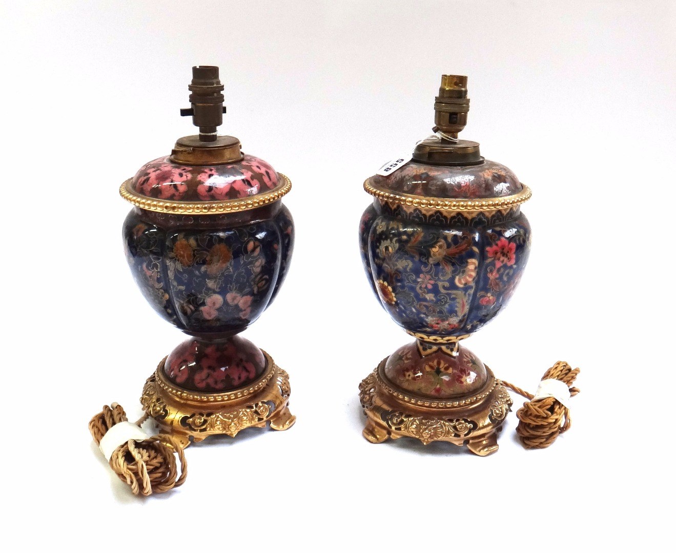 Appraisal: A pair of pottery and brass mounted table lamps late