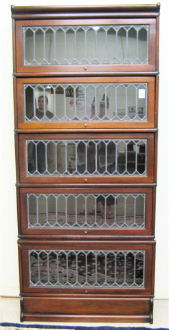 Appraisal: STACKING MAHOGANY AND LEADED GLASS SECTIONAL BOOKCASE attributed to The