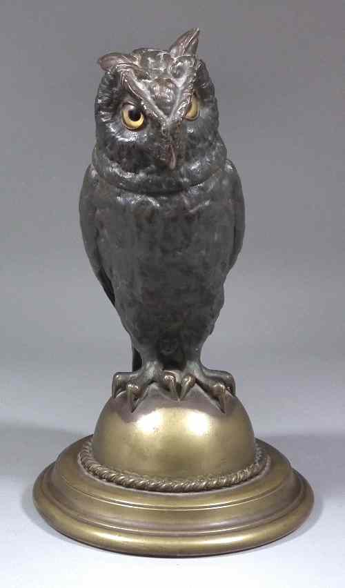 Appraisal: A bronzed metalware jar and cover modelled as an owl