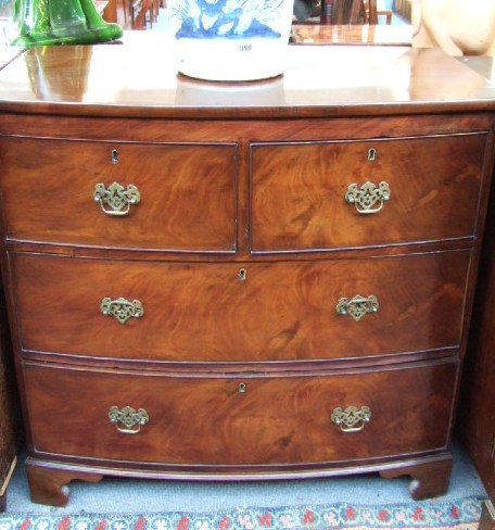 Appraisal: A th century mahogany bowfront chest of two short and