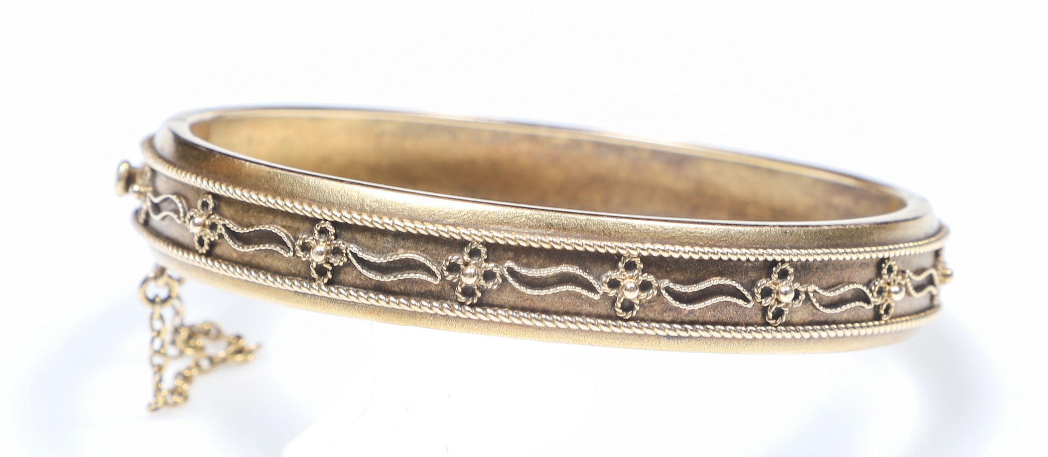 Appraisal: K yellow gold bangle in applied floral decoration DWT stamped