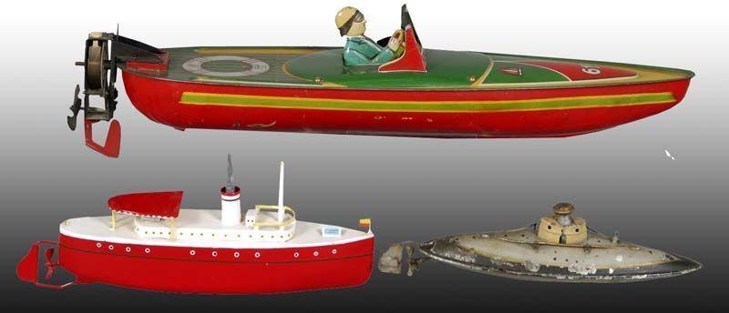 Appraisal: Lot of Tin Clockwork Boat Toys Description '' L Hand-painted