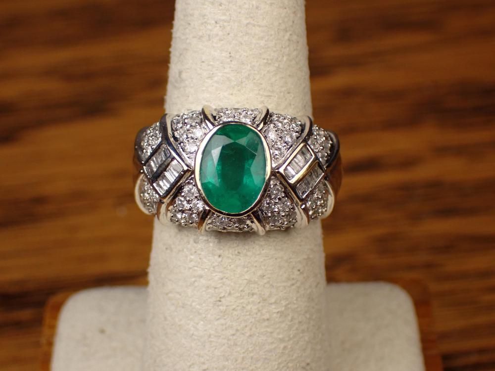 Appraisal: EMERALD DIAMOND AND EIGHTEEN KARAT GOLD RING The k white