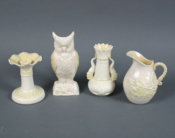 Appraisal: Four Belleek pieces owl vase candlestick pitcher and fish-handled vase