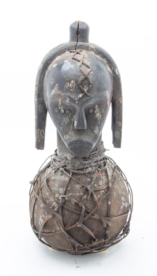 Appraisal: Sale Lot An Ethnographic Carved Wood and Metal Figure having