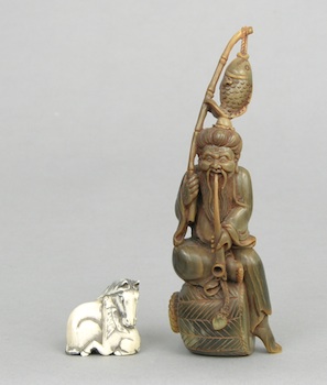 Appraisal: Two Carved Items Including Horn Ivory Small carved ivory netsuke