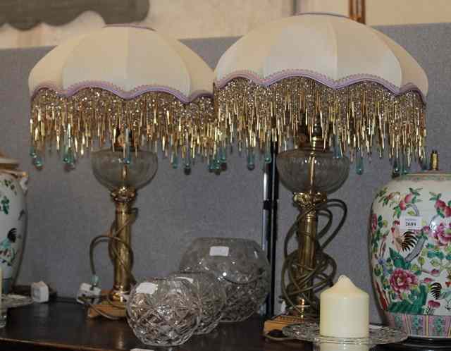 Appraisal: A PAIR OF BRASS TABLE LAMPS in the form of