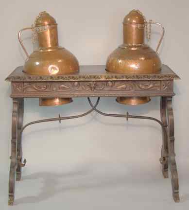 Appraisal: TWO SPANISH LIDDED COPPER VESSELS SET IN A WOODEN BASE