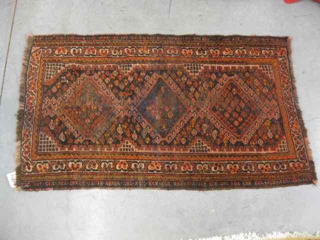 Appraisal: Kord Persian Handmade Rug geometrics reds indigo ' '' x