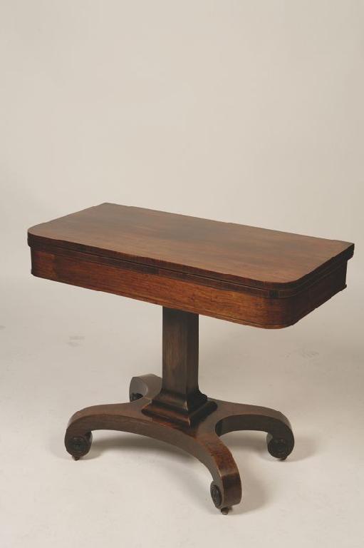 Appraisal: A REGENCY ROSEWOOD FOLD TOP CARD TABLE the shaped top