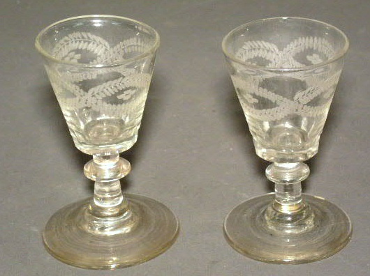 Appraisal: Two wine glasses th c with etched decoration h