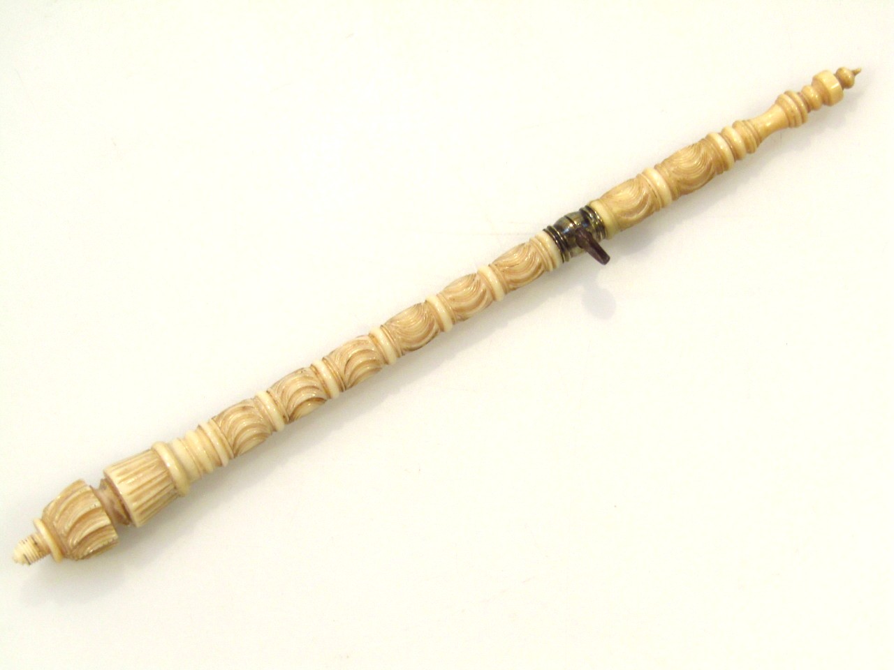 Appraisal: A late thC carved ivory tambour hook with a sectional