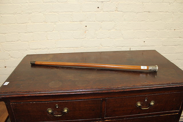 Appraisal: A TOPPED MALACCA CANE WALKING STICK with Chinese silver handle