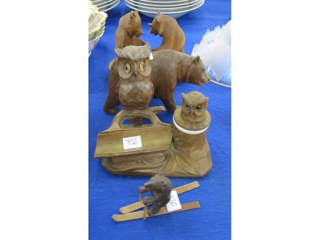 Appraisal: Four blackforest style carved wooden animal figures to include a