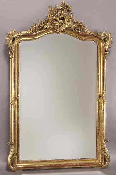 Appraisal: Louis XV style carved gilt mirroradorned with acanthus scrolls surmounted