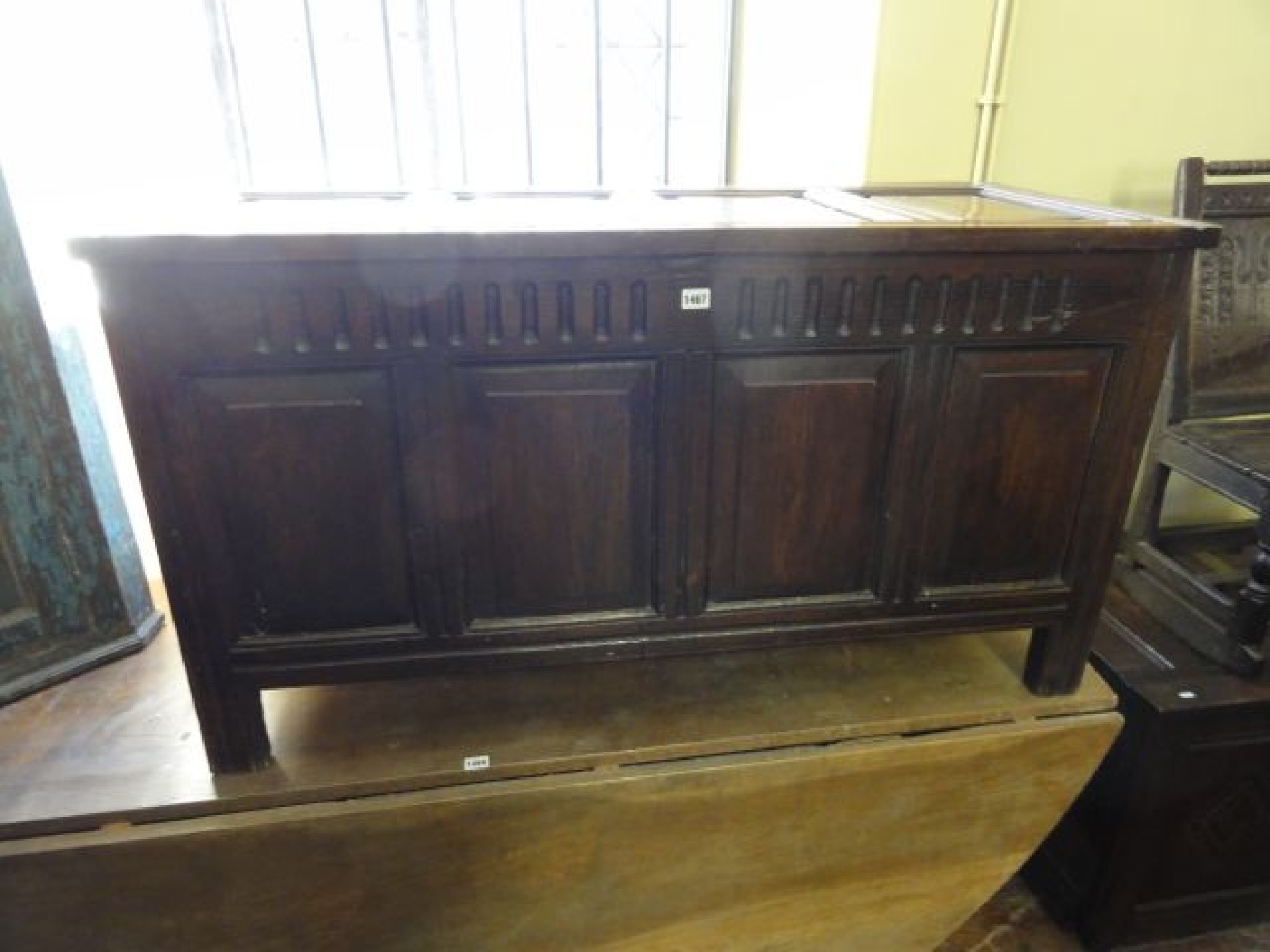 Appraisal: An antique oak coffer with fielded panelled framework and moulded