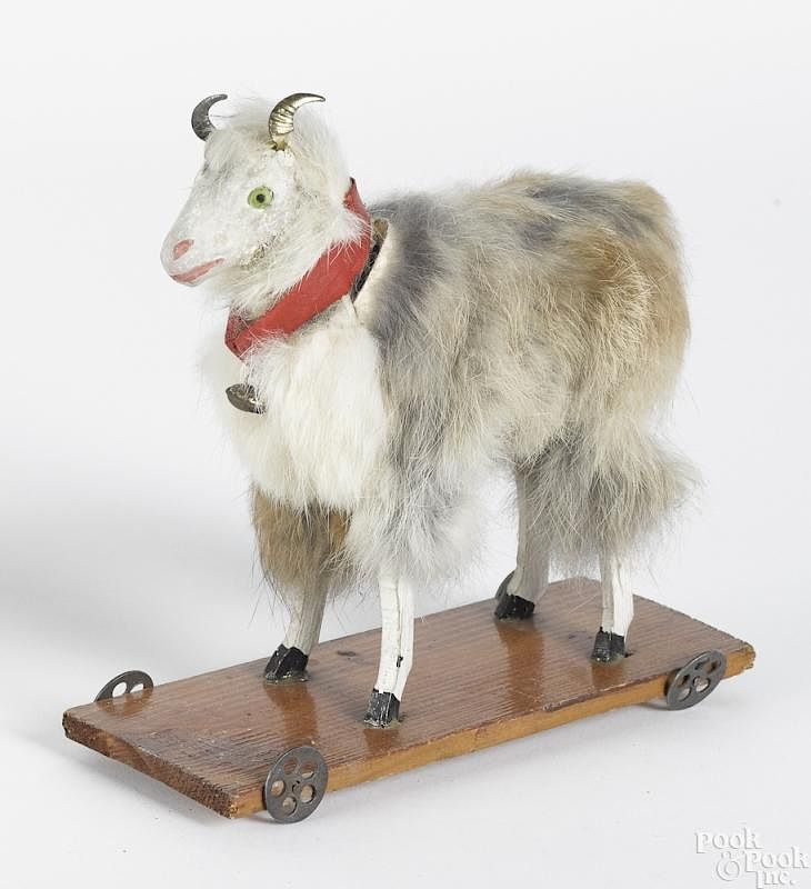 Appraisal: Stick leg goat platform pull toy Stick leg goat platform