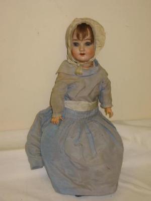 Appraisal: A Schoenau Hoffmeister bisque head doll with blue lashed eyes