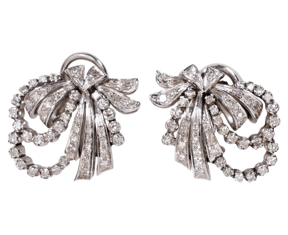 Appraisal: PR OF DIAMOND AND WHITE GOLD OMEGA CLIP EARRINGSEarrings are