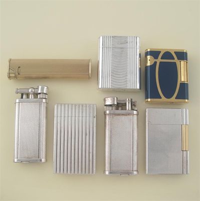 Appraisal: A gold plated and two silver plated lighters by Dunhill