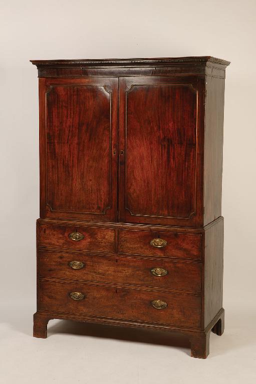 Appraisal: A GEORGE III MAHOGANY LINEN PRESS the moulded cornice with