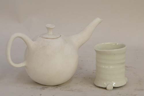 Appraisal: Bisque Teapot and Glazed Cup Ceramic on Ceramic Caplan Jerry