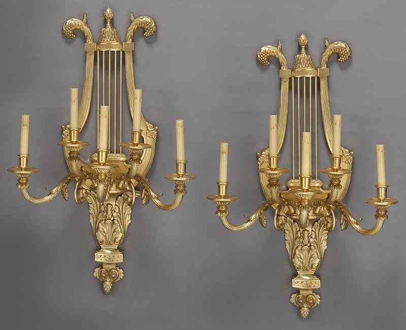 Appraisal: Pr Gilt bronze sconces of lyre form issuing fivescrolled arms