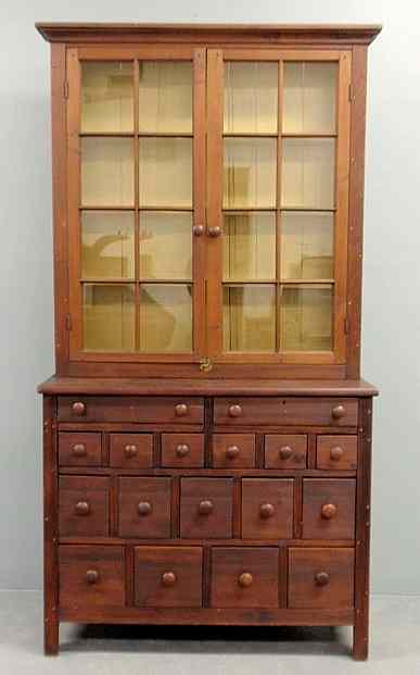 Appraisal: Pine two-piece apothecary cabinet c the upper section with a