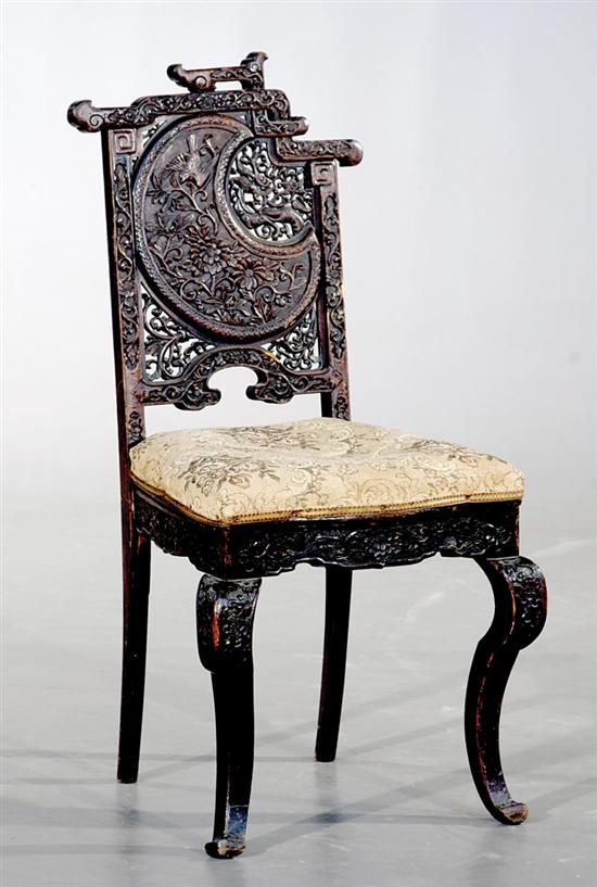 Appraisal: Anglo-Indian carved hardwood side chair th century tiered and pierce-carved