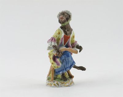 Appraisal: A Meissen monkey band figure of a female singer seated