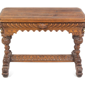 Appraisal: A Renaissance Revival Carved Oak Library Table in the Style