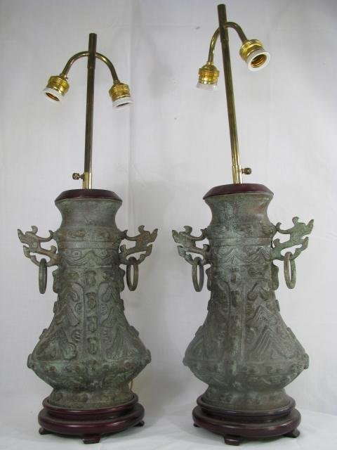 Appraisal: Pair of Asian possibly Chinese metal lamps with a great