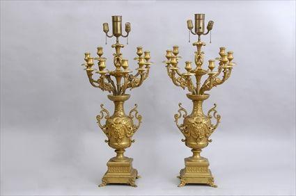 Appraisal: PAIR OF LOUIS XIV-STYLE GILT-BRONZE EIGHT-LIGHT CANDELABRA Each two-handled urn