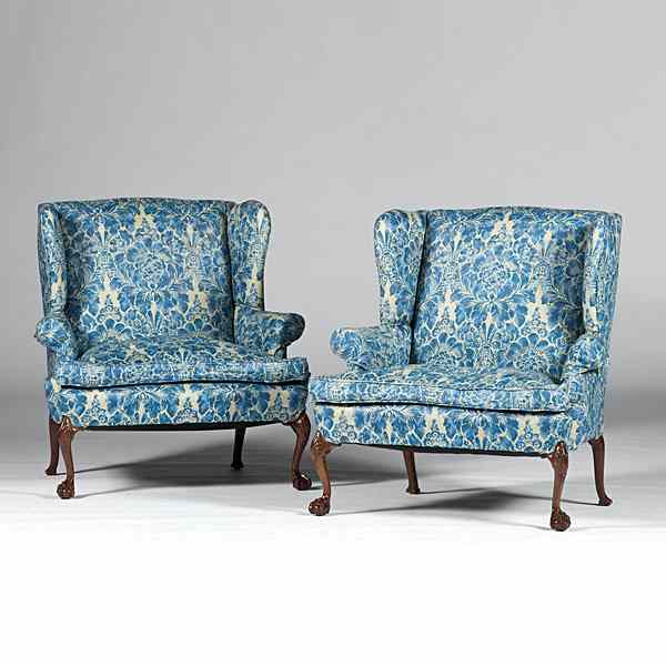 Appraisal: Georgian-style Settees English A pair of Georgian-style carved walnut upholstered