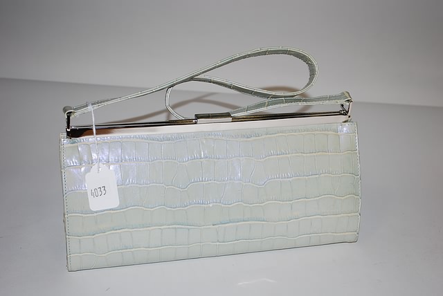 Appraisal: Neiman Marcus dyed blue green alligator purse with silver accents