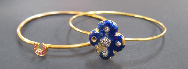 Appraisal: A YELLOW GOLD BANGLE with blue guilloche enamel trefoil applied