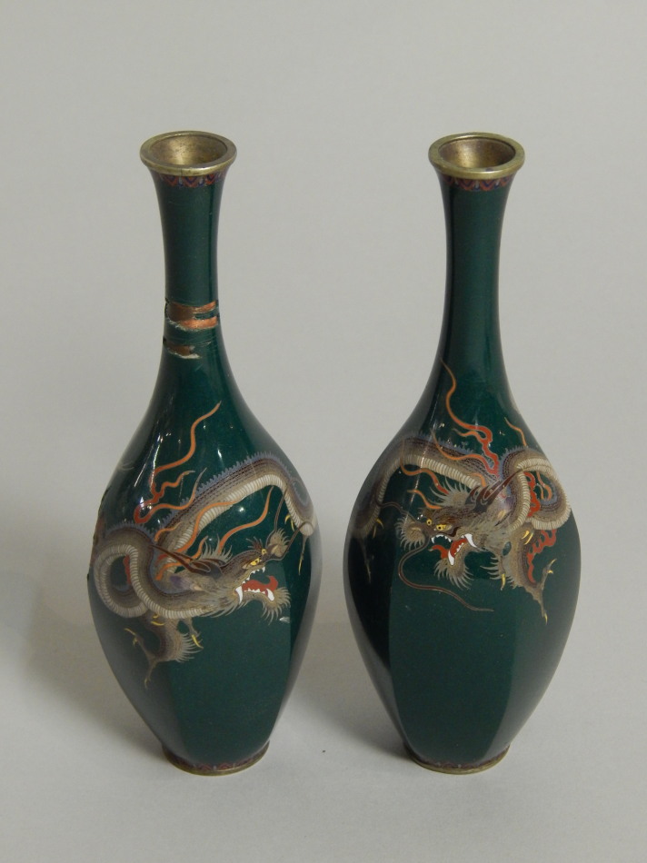 Appraisal: A pair of Japanese cloisonne white metal vases each decorated