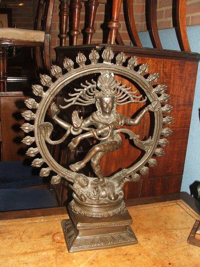 Appraisal: AN INDIAN BRONZE the Dancing Shiva within a flaming arc