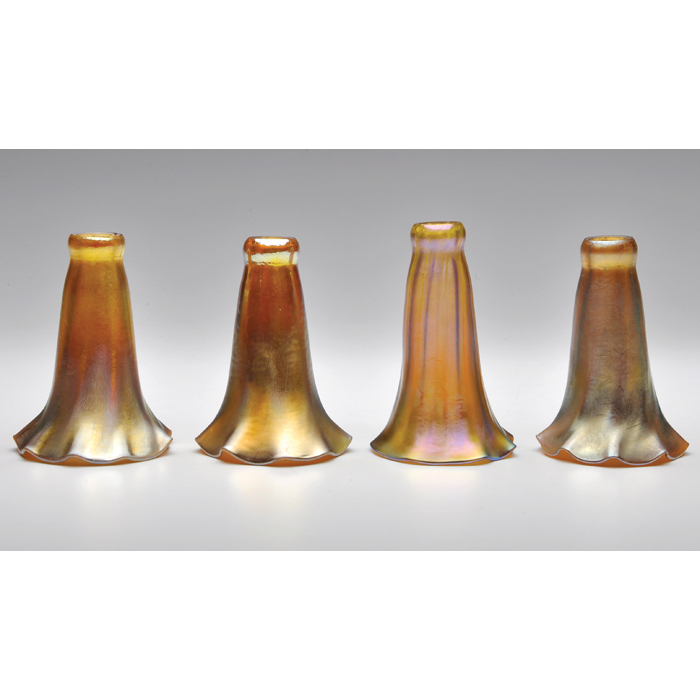 Appraisal: L C Tiffany shades four lily shades in gold favrile