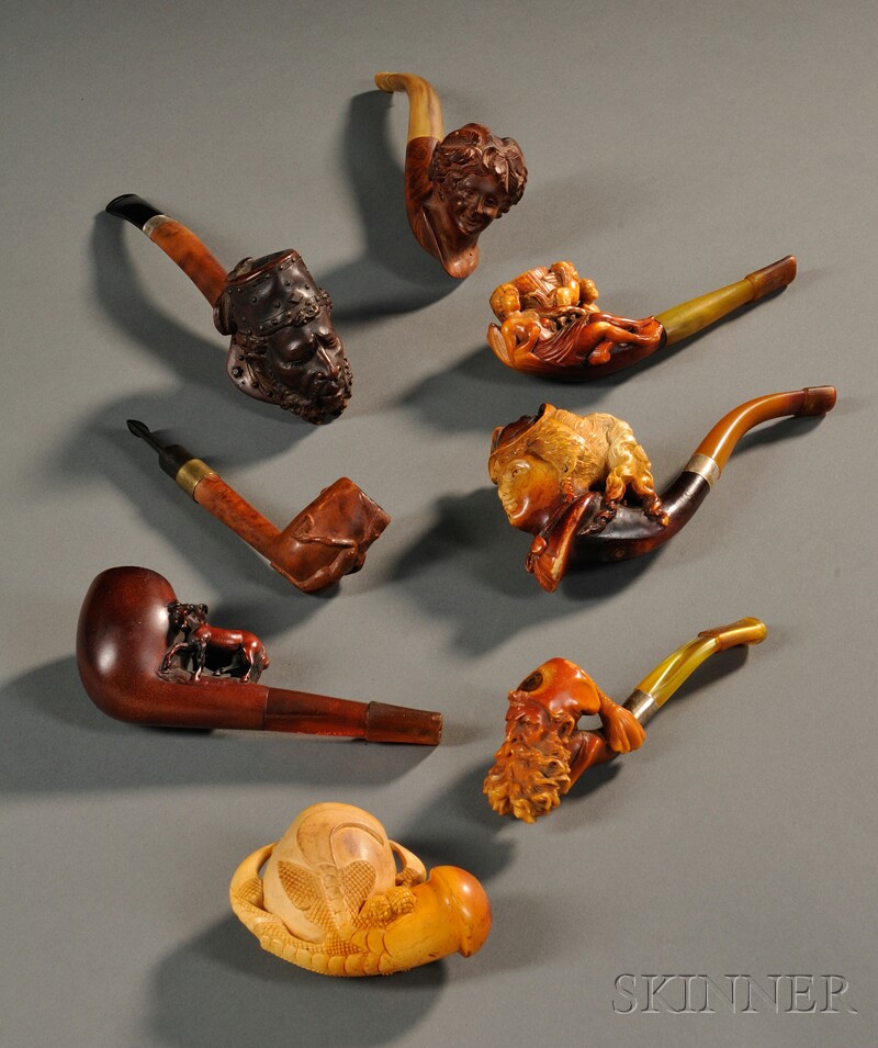 Appraisal: Eight Carved Pipes four briar pipes one of a man's