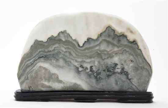 Appraisal: A Chinese Scholar's Dreamstone mounted in a black lacquer base