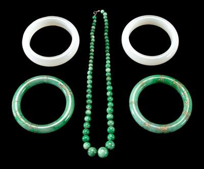 Appraisal: Five pieces hardstone jewelry two bangles mottled green with etched