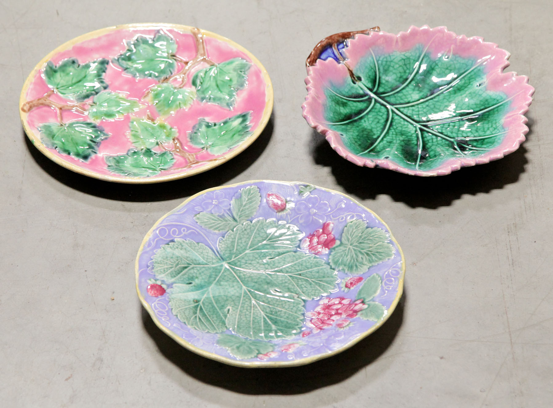 Appraisal: THREE MAJOLICA PLATES American late th century All with leaf