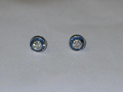 Appraisal: A PAIR OF DIAMOND AND SAPPHIRE STUD EARRINGS to match