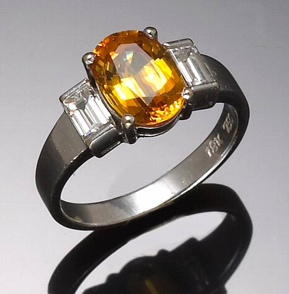 Appraisal: A golden sapphire diamond and k white gold ring estimated