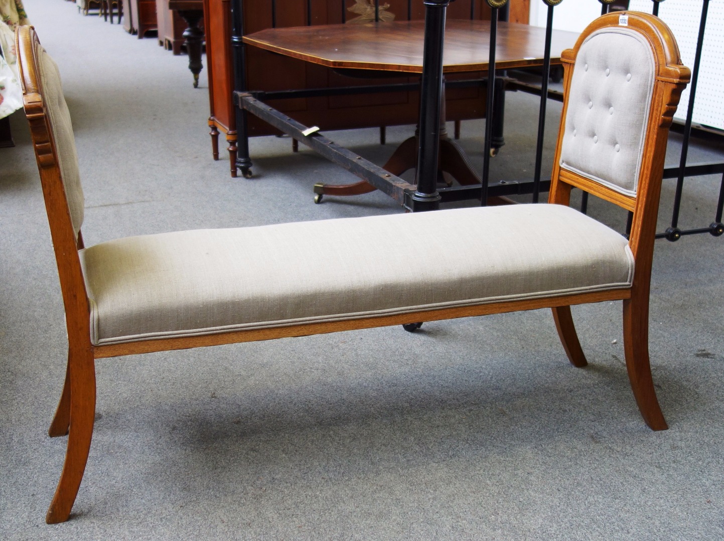 Appraisal: An oak framed double chair back window seat on sabre