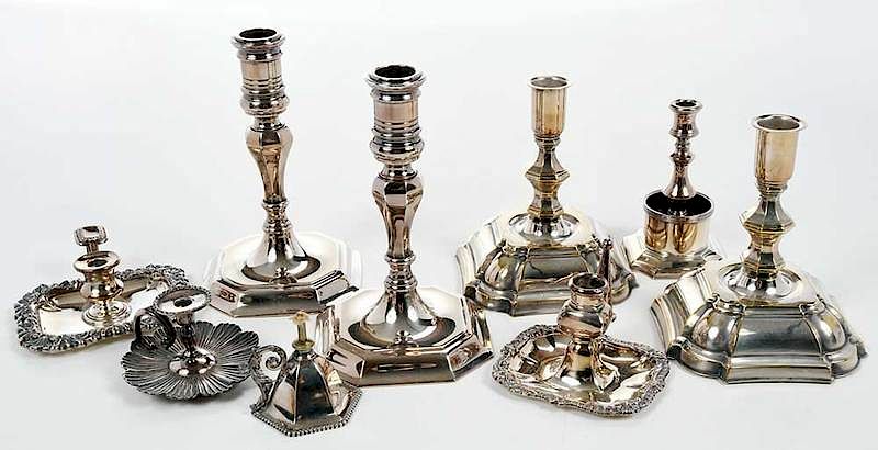 Appraisal: Nine Silver-Plated Candlesticks th th century two pair of candlesticks