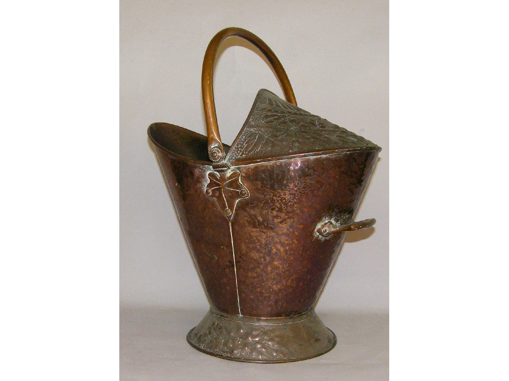 Appraisal: Arts Crafts planished copper coal helmet with a swing handle